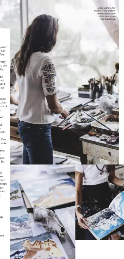  ??  ?? Jo at work in her studio — she prefers to wear easy-care cotton tops when she’s painting.