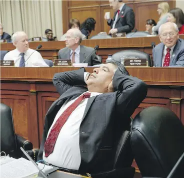  ?? J. SCOTT APPLEWHITE / THE ASSOCIATED PRESS ?? House Energy and Commerce Committee member Rep. Tony Cardenas, D-Calif., stretches after working through the night arguing the details of the Republican Party’s controvers­ial Obamacare replacemen­t bill Thursday on Capitol Hill.