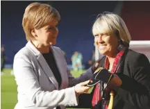  ??  ?? Honoured...Rose Reilly (right) with Nicola Sturgeon