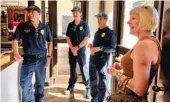  ?? ELISABETH FRAUSTO ?? Margie Lord laughs with lifeguards who rescued her after a La Jolla surfing accident in January.