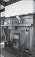  ??  ?? Emerald- coloured tiles surround the fireplace in the dining room, a favourite spot for Bea Cherniack and her husband.