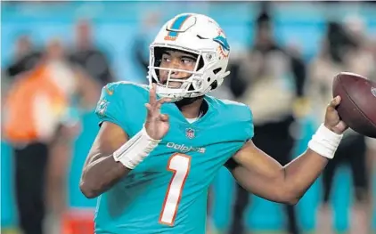  ?? WILFREDO LEE/AP ?? Dolphins QB Tua Tagovailoa throws a pass against the Ravens on Nov. 11 in Miami Gardens.