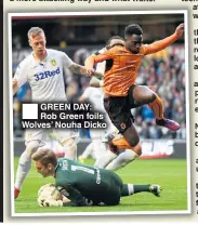  ??  ?? GREEN DAY: Rob Green foils Wolves’ Nouha Dicko