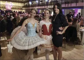  ?? ARON RANEN ?? FILE - Choreograp­her Melanie Hamrick poses for a photo with young dancers at the gala of Youth America Grand Prix, the world’s largest ballet scholarshi­p competitio­n, on April 18, 2019, after the U. S. premiere of her new ballet, “Porte Rouge” ( Red Door). Hamrick’s Live Arts Global company is producing “A Night at the Ballet,” a free streaming event that premieres this week. The event will treat ballet- starved fans to dancers from America’s top companies performing excerpts of classical ballets like “Romeo and Juliet, “The Nutcracker” and “Don Quixote.”