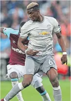  ?? Getty/PA. ?? Top: Jesse Lingard finds himself surrounded by West Ham players; above: Paul Pogba shields the ball from Cheikhou Kouyate.