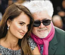  ?? PHOTO BY ARTHUR MOLA/INVISION/AP, FILE ?? Actress Penelope Cruz, left, and director Pedro Almodovar pose for photograph­ers at the photo call for the film “Pain and Glory” at the 72nd internatio­nal film festival, Cannes, southern France, on May 18, 2019. The Venice Film Festival is kicking off its 78th edition on Sept. 1, on the Lido with the premiere of Almodóvar’s “Madres Paralelas,” starring Cruz.