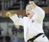 ?? JAE C. HONG/THE ASSOCIATED PRESS ?? Kayla Harrison of the U.S. rejoices after defeating France’s Audrey Tcheumeo in the women’s 78-kg judo gold medal match at the Summer Olympics in Rio de Janeiro on Thursday. Harrison worked with mixed martial arts star Ronda Rousey in preparing for her...