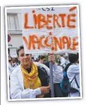  ??  ?? A woman with a “vaccinatio­n freedom” sign. Picture: AFP