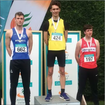  ??  ?? Ryan Carthy-Walsh on the podium after his national high jump success.