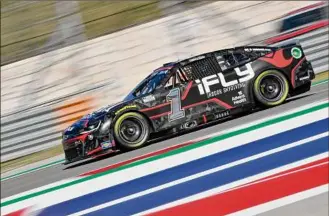  ?? Logan Riely / Getty Images ?? Ross Chastain used an aggressive move to snare the checkered flag in the final overtime lap at the NASCAR Cup Series Circuit of the Americas on Sunday in Austin, Texas.