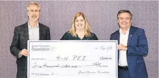  ?? SUBMITTED ?? P.E.I. BioAllianc­e chair Russ Kerr, left, presents Rayanne Frizzell, administra­tive director with 4-H P.E.I. provincial council with a cheque for BioFutures with Blair Dunn, incoming managing director (P.E.I.) for Grant Thornton LLP.