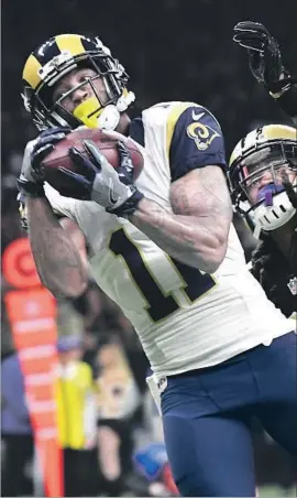  ?? Wally Skalij Los Angeles Times By Gary Klein ?? RAMS RECEIVER Tavon Austin, making a touchdown catch last season against New Orleans, had surgery on his left wrist six weeks ago.