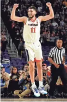  ?? BOB DONNAN/USA TODAY SPORTS ?? Virginia guard Ty Jerome celebrates after beating the Auburn.