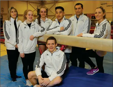  ??  ?? Judge Pauline Smith with gymnasts Cara Kennedy, Shannon Archer, Kelvin Cham and coaches Marius Gherman and Sandra Stevenson. At the front is gymnast David Weir Pictures: Colin Mearns