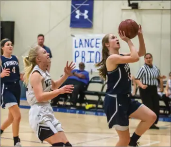  ?? Photo courtesy of Wally Caddow ?? Trinity Classical Academy freshman Katie Brown goes up for a layup in a CIF-Southern Section Division 5A quarterfin­al game against Western Christian High School at Western Christian on Wednesday.