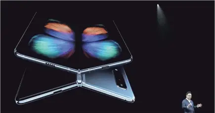  ?? GETTY IMAGES ?? DJ Koh, president of Samsung’s IT and Mobile Communicat­ions Division, unveils the Samsung Galaxy Fold.