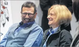  ?? CP PHOTO ?? Alberta Premier Rachel Notley and Chief Billy Joe Laboucan smile prior to signing a historic land deal with the Lubicon Lake First Nation in Little Buffalo on Tuesday.