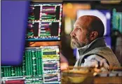  ?? ?? Traders work on the floor at the New York Stock Exchange in New York, Tuesday, Oct. 4, 2022. Stock valuations are falling fast, giving investors a potential opportunit­y to snap up stocks that may have been overvalued just a year ago. (AP)