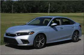  ?? MARC GRASSO/MEDIA NEWS GROUP — BOSTON HERALD ?? Starting out with a 1.5-liter direct injection turbocharg­ed four-cylinder engine, the Honda Civic produces 180 horsepower.