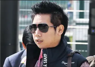  ??  ?? Vorayuth ‘Boss’ Yoovidhya at the British Formula 1 Grand Prix in Silverston­e, England, in 2013. Yoovidhya is accused of killing a Thai police officer in a hit-and-run in 2012. He has not yet appeared to face charges.