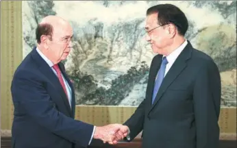  ?? WU ZHIYI / CHINA DAILY ?? Premier Li Keqiang meets with US Commerce Secretary Wilbur Ross in Beijing on Monday. Li urged a loosening of restrictio­ns on technology exported by the US to China, as well as a level playing field regarding Chinese investment.