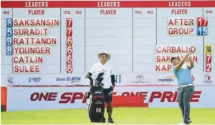  ?? Agence France-presse ?? Poom Saksansin of Thailand (right) in action during the second round of the Indonesian Masters at the Royale Jakarta Golf Club in Jakarta on Friday.