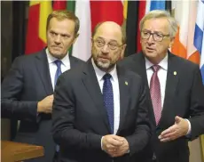  ??  ?? BRUSSELS: European Council President Donald Tusk (left) walks with European Parliament President Martin Schulz (center) and European Commission President Jean-Claude Juncker at the European Council building in Brussels. The 28-nation EU has been rocked...