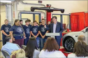  ?? EMILY OVERDORF — FOR MEDIANEWS GROUP ?? With the students of Pottstown High Schools automotive technologi­es class behind him, state Rep. Joe Ciresi, D-146th Dist., talks about Pottstown being underfunde­d by more than $13 million each year, which made the wheel alignment machine unaffordab­le.