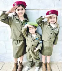  ?? (Rena Mednick) ?? CHILDREN CELEBRATE Purim, dressed in soldier costumes.