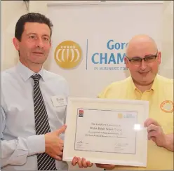  ??  ?? AIB Gorey branch manager Keith Groarke presents John Doyle of Myles Doyle Select Grocer with his North Wexford Business Award for Retail at a Gorey Chamber lunch in Seafield Hotel, Ballymoney..