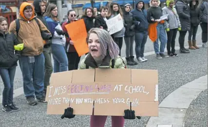  ?? Stephanie Strasburg/Post-Gazette ?? Seventh-grader Christina Campbell, 12, of Brighton Heights shouts to fellow students at Pittsburgh Creative and Performing Arts School as they take part in the National School Walkout.