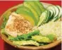  ?? LINDA GASSENHEIM­ER/TNS ?? A Salmon Bowl pairs a fresh salmon fillet on a bed of lettuce with avocado slices, cucumber slices and cauliflowe­r rice.