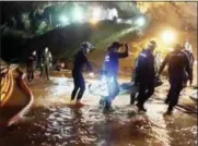  ?? THAI NAVYSEAL FACEBOOK PAGE VIA AP ?? Rescuers hold an evacuated boy inside the Tham Luang Nang Non cave in Mae Sai, Chiang Rai province, in northern Thailand.