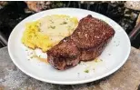  ?? ?? A cast iron-seared rib-eye is a centerpiec­e of the menu at Range at Embassy Suites by Hilton San Antonio Riverwalk Downtown.