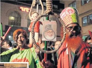  ?? EPA ?? ABOVE Protesters hold a photo of convicted Jamaat-e-Islam leader Motiur Rahman Nizami, in front of the central jail on Tuesday before his execution in Dhaka.