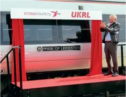  ?? Andy Coward ?? Leicester City Mayor Sir Peter Soulsby applauds the work done by Crosscount­ry and UK Rail Leasing on establishi­ng a service facility at Leicester Depot, following the unveiling of Pride of Leicester nameplates on the side of ‘Turbostar’ 170622. The nameplates are cast metal, rather than vinyl transfers which are usually applied to units.