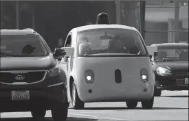  ?? TRIBUNE NEWS SERVICE FILE PHOTOGRAPH ?? A Google self-driving car travels eastbound on San Antonio Road in Mountain View in October 2015.