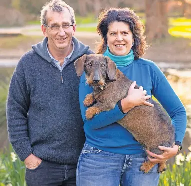  ?? ?? Kiwi Country grain-free dog food was created by Ashburton couple Jeremy and Mary Stewart, pictured with their wire-haired dachshund Frankie.
