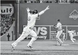  ?? GREG M. COOPER/USA TODAY SPORTS ?? Red Sox right fielder Shane Victorino reacts after hitting a grand slam during the seventh inning on Saturday night.