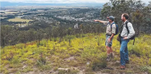  ?? Picture: SUPPLIED ?? CONQUER: James Altaffer and Michael Overland from Queensland Parks and Wildlife Services taking in the view of Atherton from the top of Mt Baldy.