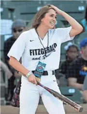 ?? PATRICK BREEN/AZCENTRAL SPORTS ?? Becca Longo, first woman to receive a college football scholarshi­p, hits during the Larry Fitzgerald Double Play Celebrity Softball Home Run Derby at Salt River Fields in Scottsdale, Ariz. on April 22, 2017.