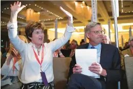  ?? JESSICA HILL/AP ?? Republican gubernator­ial candidate Bob Stefanowsk­i, right, listens as delegate votes are cast with wife Amy at the State Republican Convention on Friday night at Foxwoods Resort Casino.