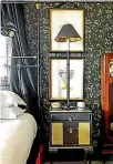  ??  ?? Patrick Crawshaw has used black, dark red, greys, dark woods and a touch of gold throughout his house.