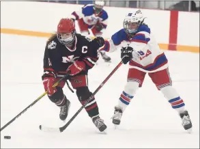  ?? Dave Stewart / Hearst Connecticu­t Media ?? New Canaan’s Grace Crowell, left, and West Haven/SHA’s Juliann Picard battle for the puck at Bennett Rink in West Haven on Saturday.