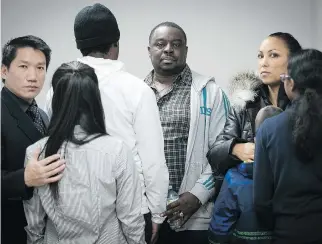  ?? PIERRE OBENDRAUF ?? Erik Tran, left, Stanley Charles and Asha with their children at CRARR on Thursday. “I am a Quebecer,” Charles says. “I just want my son to be treated fairly and in a just manner, like every other Quebecer.”