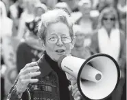  ?? CALVIN MATTHEIS/NEWS SENTINEL ?? Ansley speaks during a silent march in 2017 protesting immigratio­n and refugee bans. She was a staunch community advocate for immigrants’ rights.