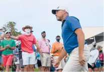  ?? GETTY KEVIN C. COX/ ?? Lee Westwood walks from the 18th green after the third round of The Players Championsh­ip on Saturday at TPC Sawgrass.