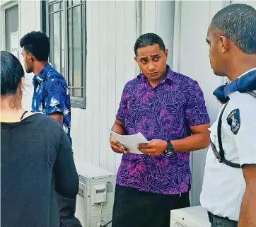 ?? Photo: Shreeya Verma ?? Gade Gaunavou (second from right) was one of five people charged with social gathering restrictio­n breaches. He is seen here outside the Suva courthouse on May 9, 2020.
Nemani Delaibatik­i M: (679) 9777236 Email: nemani.delaibatik­i@ fijisun.Com.Fj
