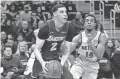  ??  ?? Lakers guard Lonzo Ball drives past Pistons guard Ish Smith during a game last season.