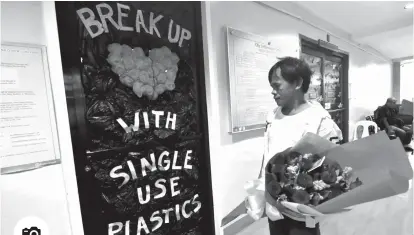  ?? Photo by MACKY LIM ?? SWEETEST BREAK UP. The Davao City Informatio­n’s Office decorates its door with its Valentine’s Day advocacy against single use plastics.